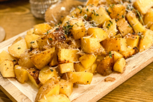 roasted potatoes on a cutting board